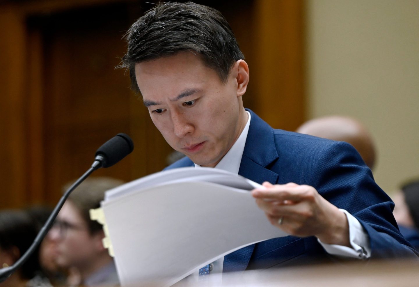 TikTok CEO Shou Zi Chew looks at his notes as he testifies before the House Energy and Commerce Committee hearing on &#8220;TikTok: How Congress Can Safeguard American Data Privacy and Protect Children from Online Harms,&#8221; on Capitol Hill, March 23, 2023, in Washington, DC. (Photo by OLIVIER DOULIERY / AFP) (Photo by OLIVIER DOULIERY/AFP via Getty Images)