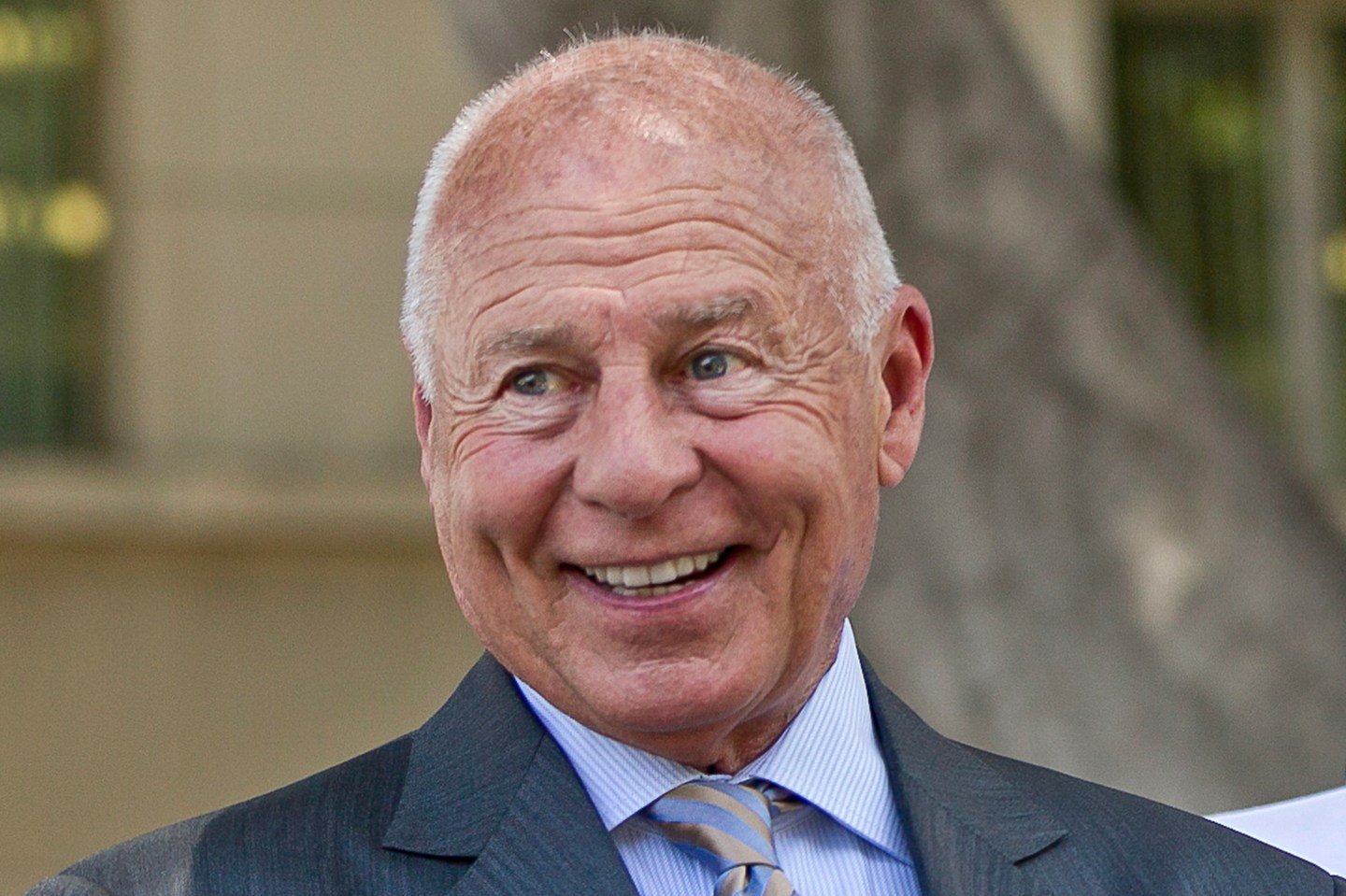 FILE &#8211; Attorney Tom Girardi smiles outside the Los Angeles courthouse, July 9, 2014. (AP Photo/Damian Dovarganes, File)