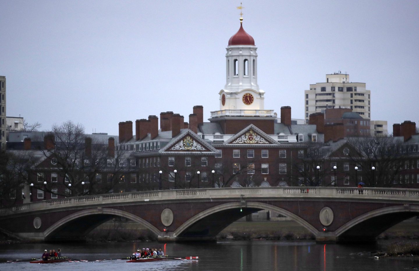 FILE &#8211; Rowers paddle down the Charles River near the campus of Harvard University in Cambridge, Mass., March 7, 2017. (AP Photo/Charles Krupa, File)