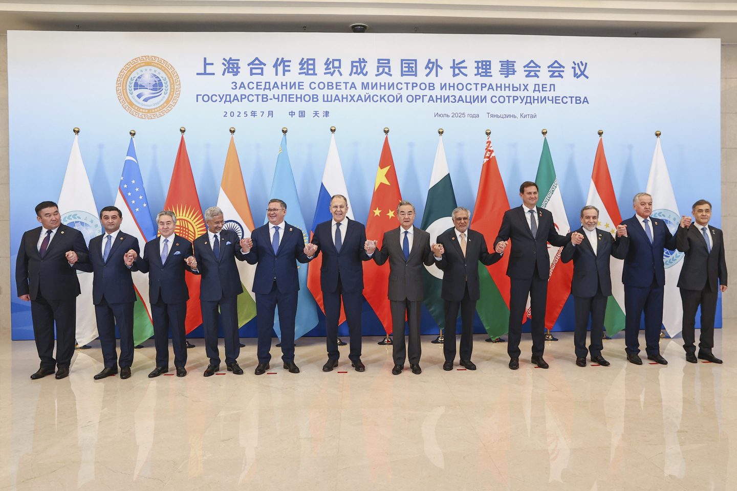 Russian Foreign Minister Sergey Lavrov, center left, and Chinese Foreign Minister Wang Yi, center right, pose for a photo with other officials during the meeting on the Council of Foreign Ministers of the Shanghai Cooperation Organization (SCO), in Tianjin, China. 