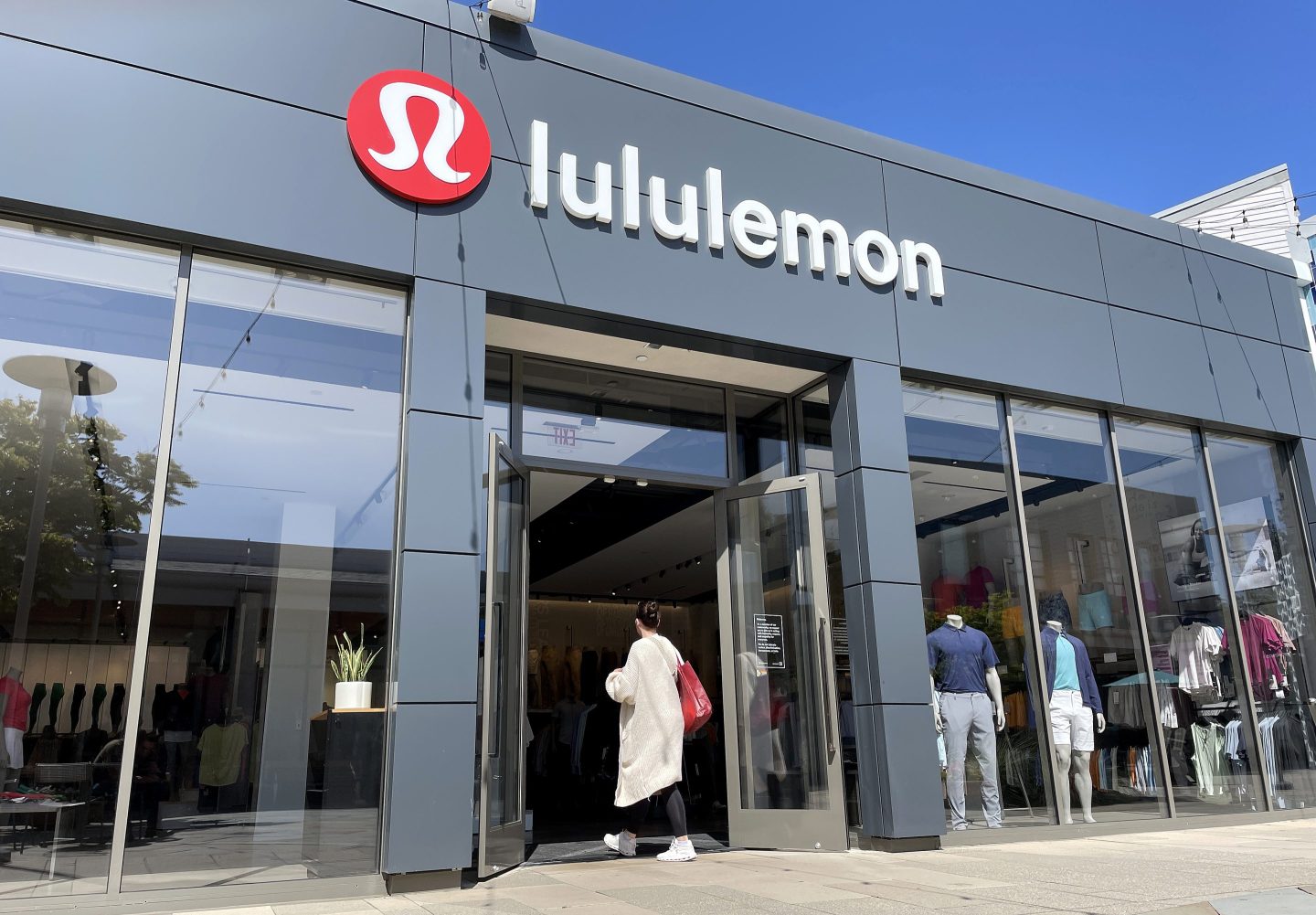 woman walking into lululemon store