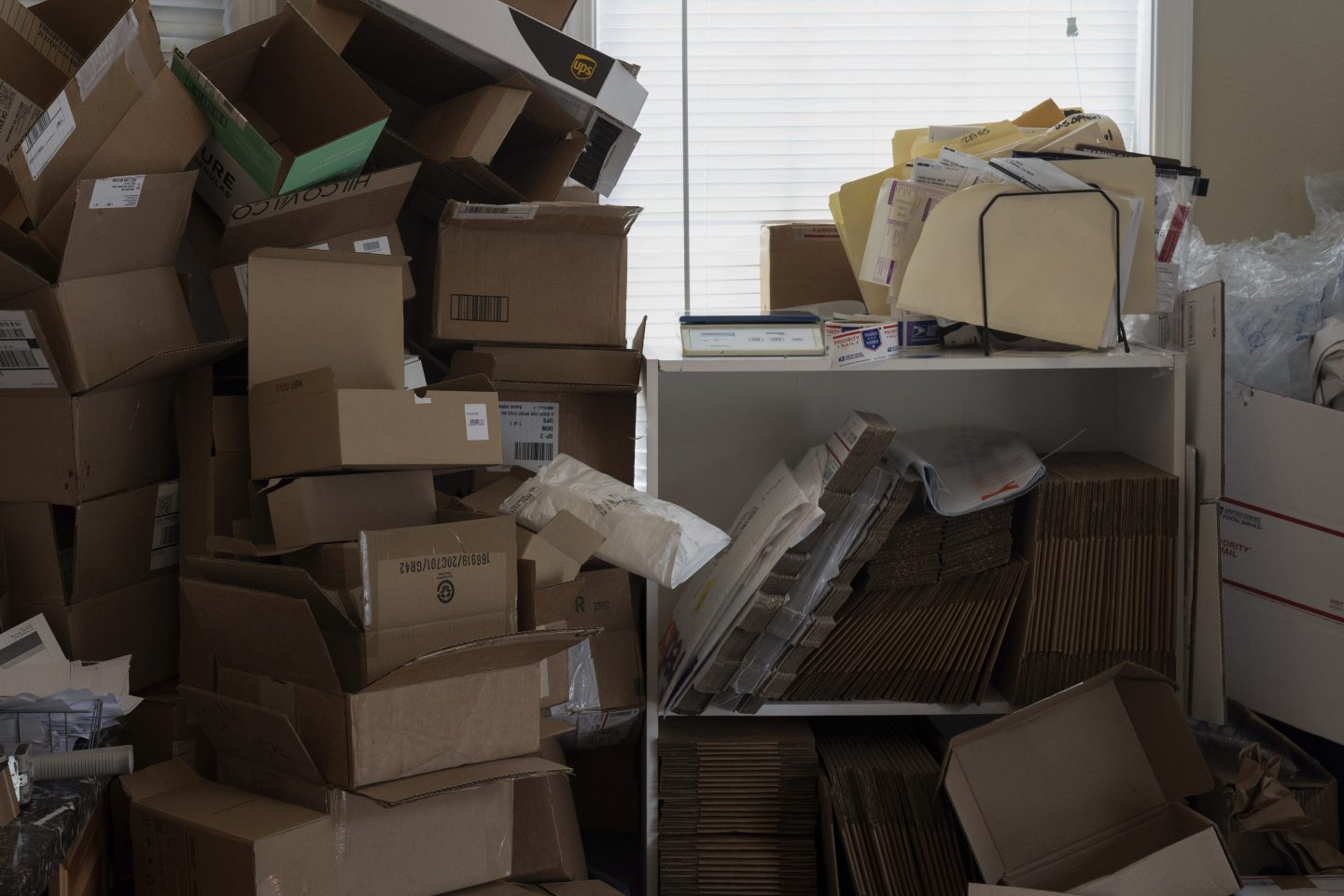 Empty boxes are stacked for reuse at A Sight For Sport Eyes, a brick-and-mortar and e-commerce store for sport goggles, Aug. 20, 2025, in West Linn, Ore.