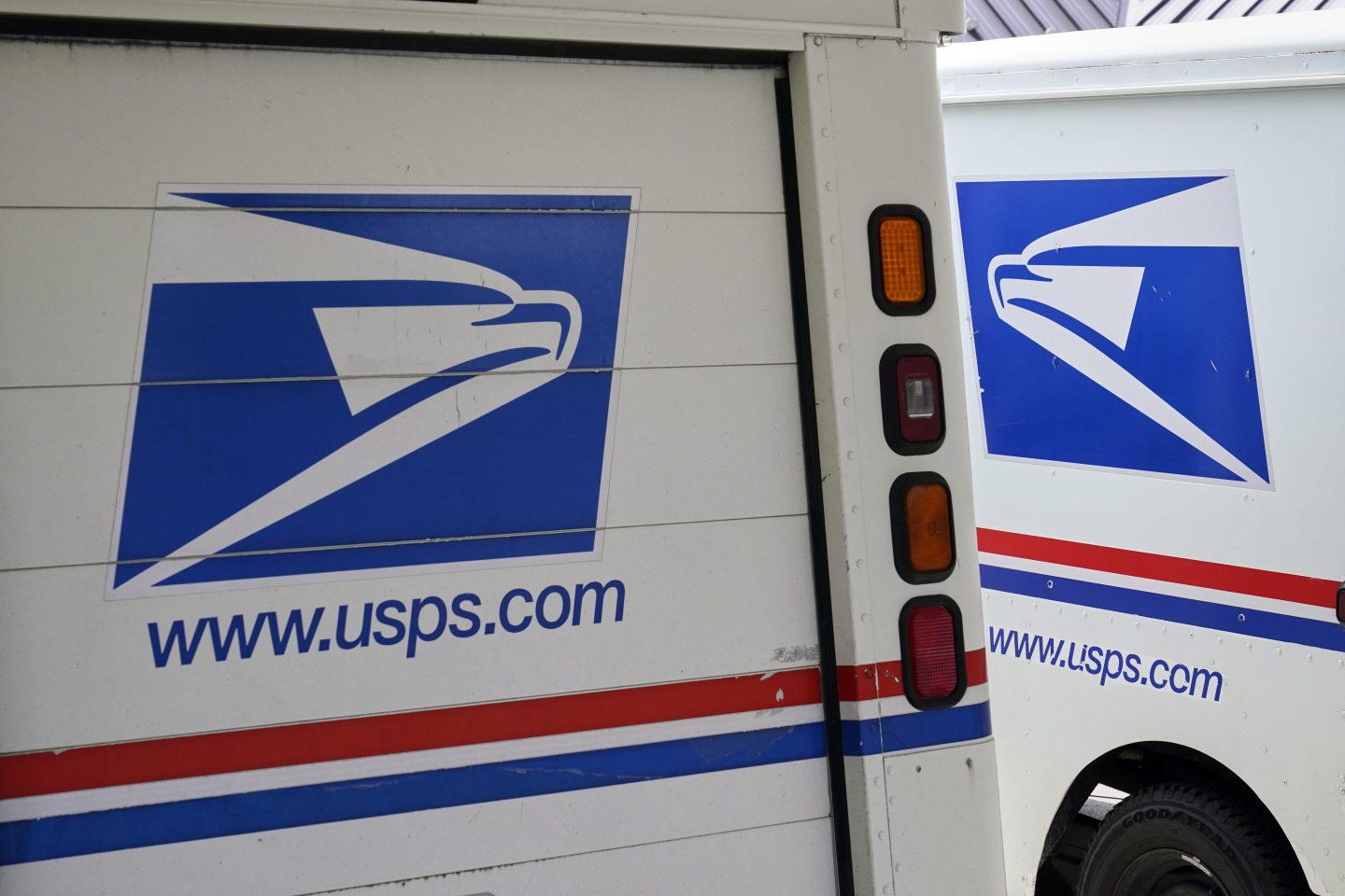 FILE &#8211; U.S. Postal Service delivery vehicles are parked outside a post office in Boys Town, Neb., Aug. 18, 2020. (AP Photo/Nati Harnik, File)