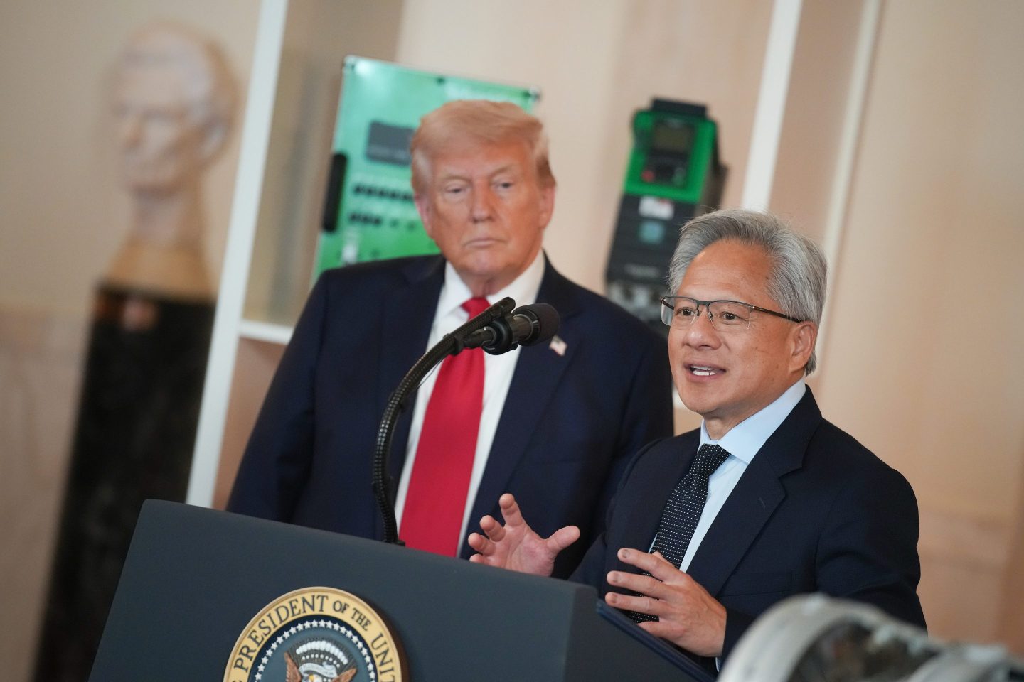 WASHINGTON, DC &#8211; APRIL 30: U.S. President Donald Trump (L) listens as Nvidia CEO Jensen Huang speaks in the Cross Hall of the White House during an event on &#8220;Investing in America&#8221; on April 30, 2025 in Washington, DC. Trump was joined by CEOs to highlight companies and their investments in the United States during the event. (Photo by Andrew Harnik/Getty Images)