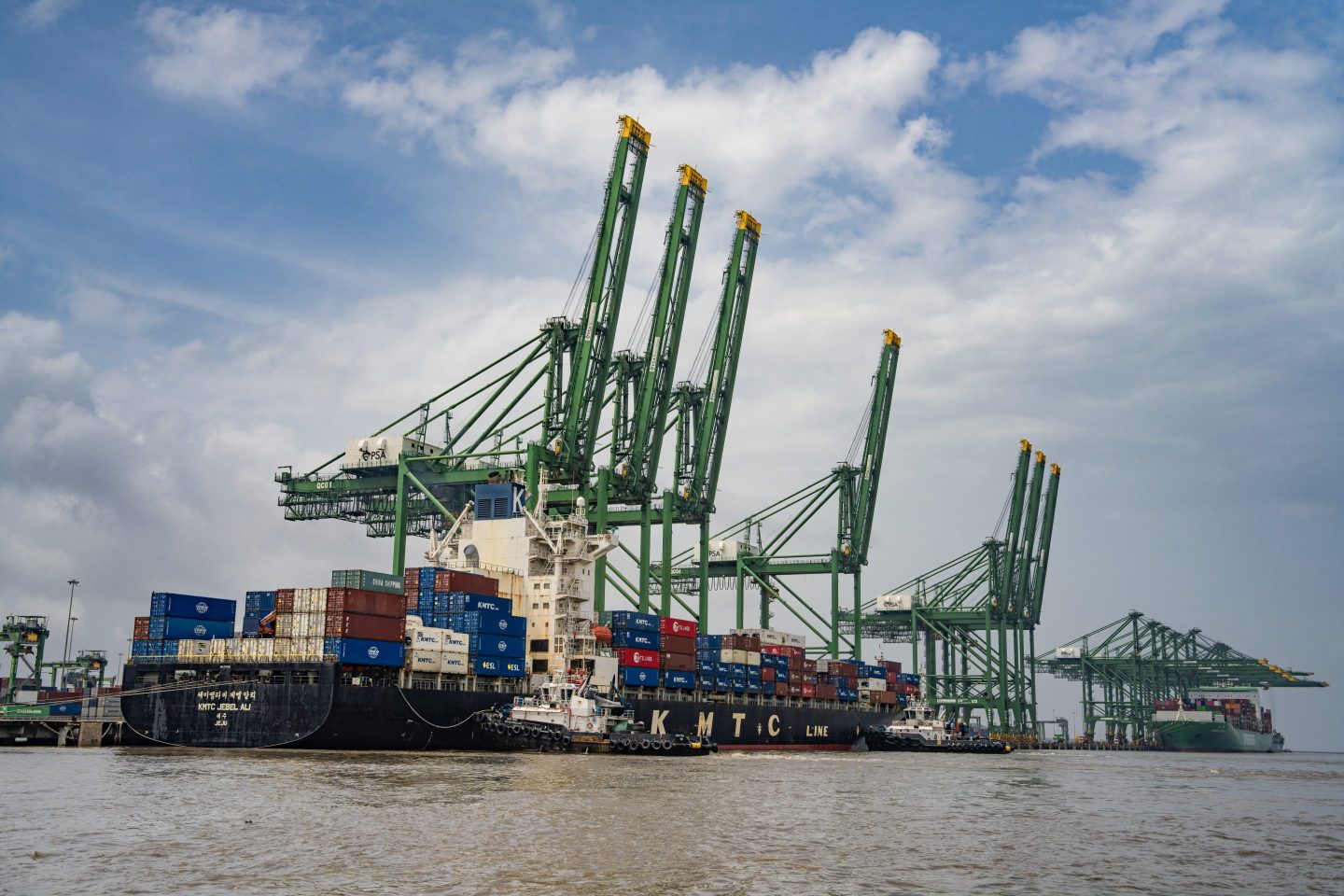 Shipping containers stacked on the KMTC Jebel Ali container ship at Jawaharlal Nehru Port in Navi Mumbai, Maharashtra, India, on Saturday, Aug. 9, 2025. US President Donald Trump said he&#8217;d impose a 50% tariff on Indian exports to the US  half of which includes a penalty for purchases of Russian oil. Photographer: Abeer Khan/Bloomberg via Getty Images