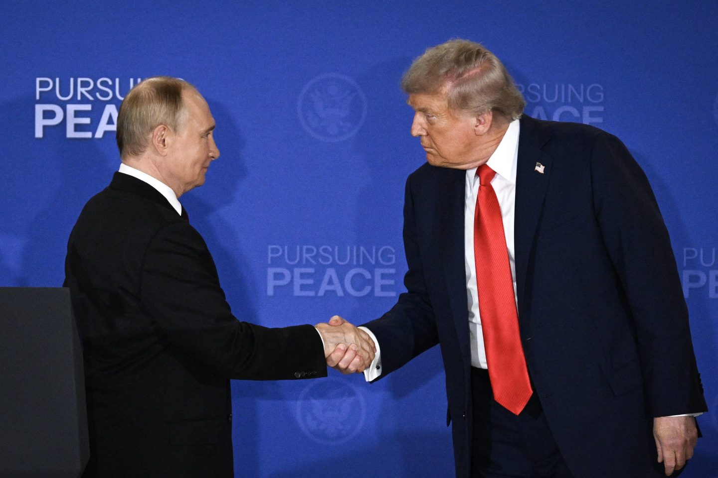 US President Donald Trump (R) and Russian President Vladimir Putin shake hands at the end of a joint press conference after participating in a US-Russia summit on Ukraine at Joint Base Elmendorf-Richardson in Anchorage, Alaska, on August 15, 2025. (Photo by Drew ANGERER / AFP) (Photo by DREW ANGERER/AFP via Getty Images)