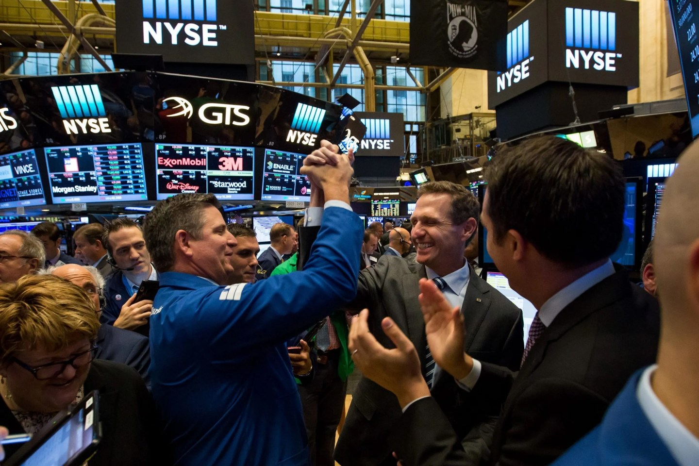 Traders celebrate a IPO at the NYSE