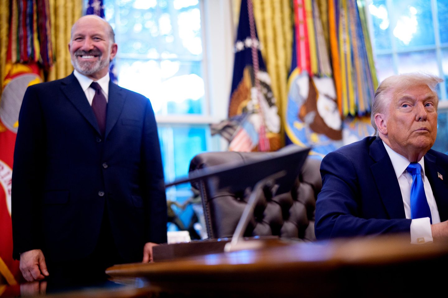 WASHINGTON, DC &#8211; SEPTEMBER 19: U.S. President Donald Trump, accompanied by U.S. Commerce Secretary Howard Lutnick (L), takes a question from a reporter before signing executive orders in the Oval Office at the White House on September 19, 2025 in Washington, DC. Trump signed two executive orders, establishing the &#8220;Trump Gold Card&#8221; and introducing a $100,000 fee for H-1B visas. The &#8220;Trump Gold Card&#8221; is a visa program that allows foreign nationals permanent residency and a pathway to U.S. citizenship for a $1 million investment in the United States. (Photo by Andrew Harnik/Getty Images)
