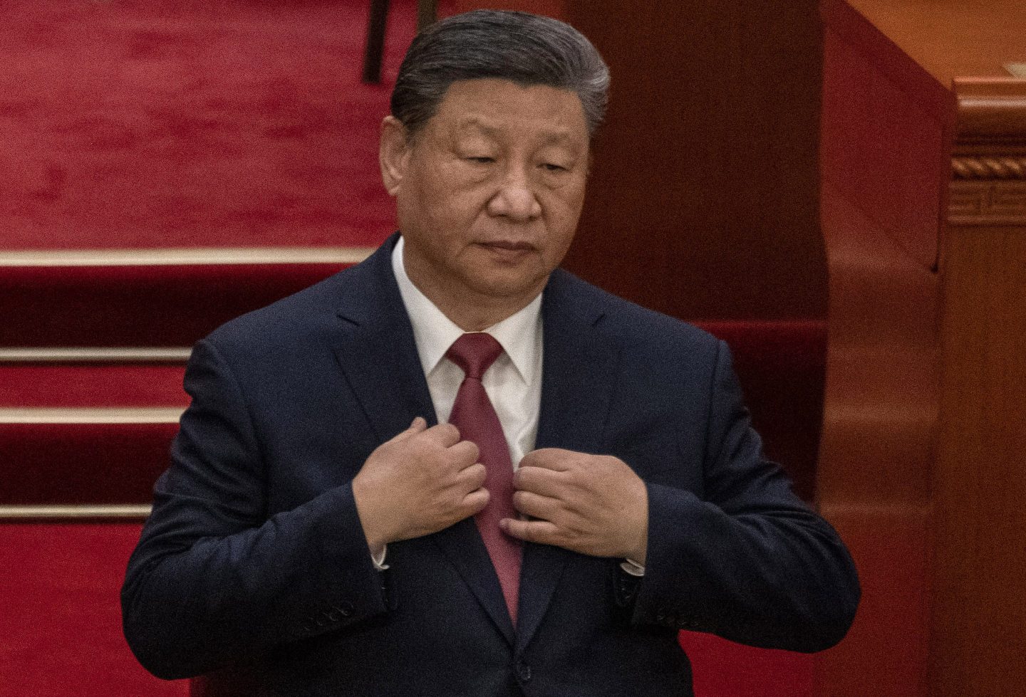 BEIJING, CHINA &#8211; MARCH 10: Chinese President Xi Jinping adjusts his jacket during the closing session of the Chinese People&#8217;s Political Consultative Conference, or CPPCC, at the Great Hall of the People on March 10, 2025 in Beijing, China. China&#8217;s annual political gathering known as the Two Sessions convene leaders and lawmakers to set the government&#8217;s agenda for domestic economic and social development for the year. (Photo by Kevin Frayer/Getty Images)