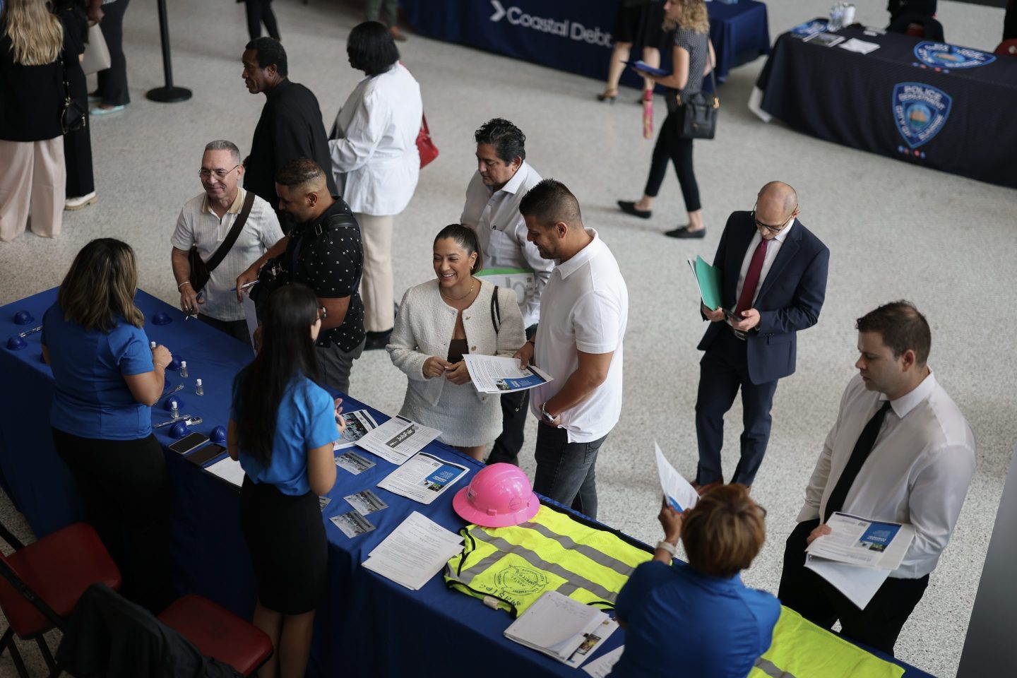 SUNRISE, FLORIDA &#8211; SEPTEMBER 25: Job seekers inquire about jobs at the MasTec company booth during the Mega JobNewsUSA South Florida Job Fair held in the Amerant Bank Arena on September 25, 2025 in Sunrise, Florida. Hiring managers and recruiters attended the job fair to recruit workers for some of the positions businesses are trying to fill in Miami, Broward, and Palm Beach Counties. (Photo by Joe Raedle/Getty Images)